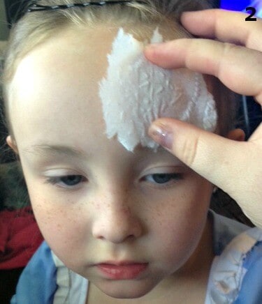 The secret for a super cool zombie makeup for kids is toilet paper.