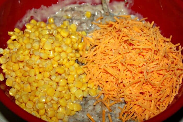 Corn and cheddar cheese makes cowboy casserole super tasty.