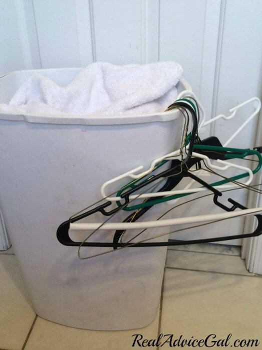 Real Advice Gal life hack when folding laundry hang your hangers on the side of the laundry basket