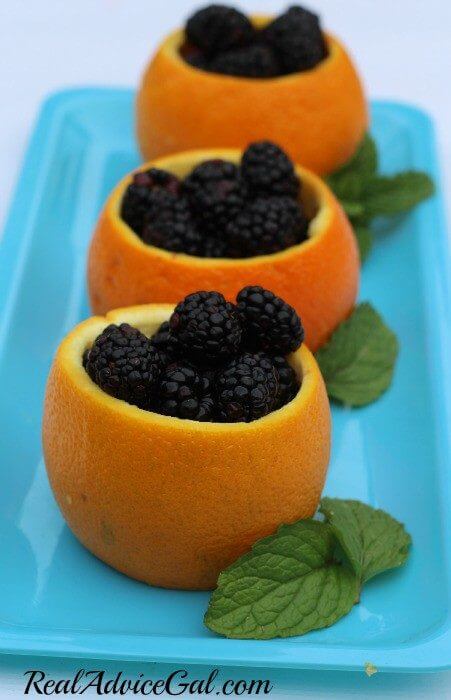 How to hollow out oranges to use as fruit bowls filed with blackberries