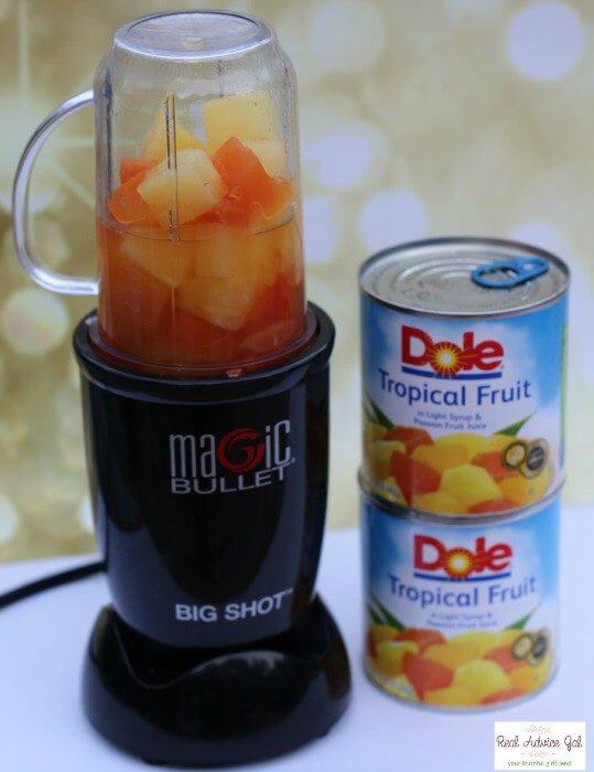 Tropical Fruit Sorbet pour fruit and juice into a blender