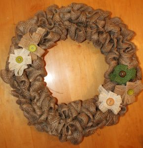 burlap wreath finished and decorated with burlap flowers
