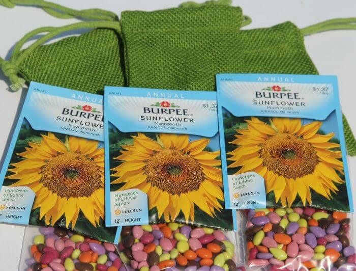 bridal shower party favors fill a burlap bag with a packet of sunflower seeds and chocolate covered sunflowers
