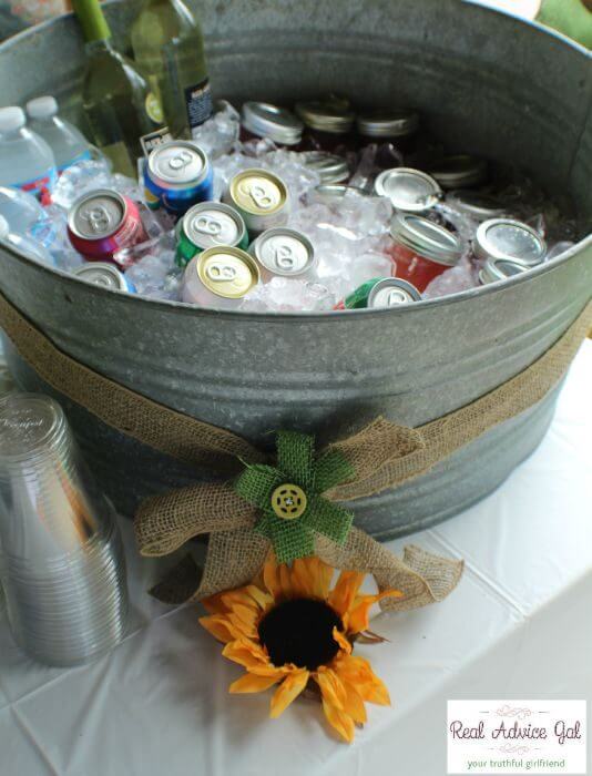 burlap and sunflowers old farm bin filled with ice and drinks