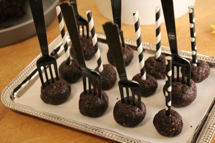 Chocolate Butterfinger Cake Pops on a tray ready to be chilled