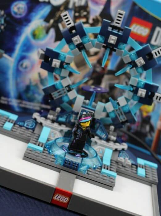 Lego Dimensions starter pack comes with Wildstyle, Batman, and Gandalf. 