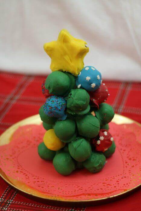 OREO Cookie Balls look so preet stacked as a Christmas tree with a star on top
