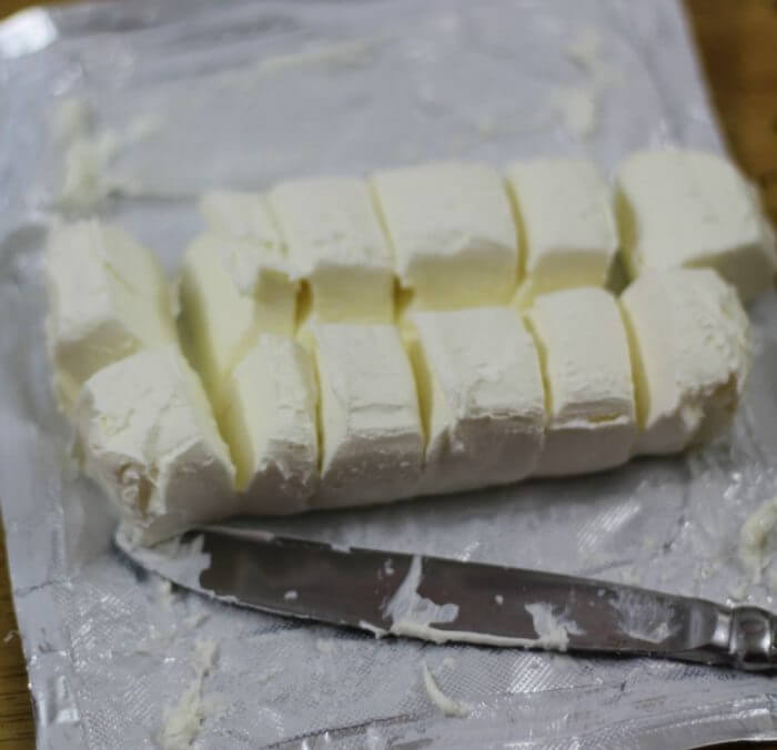 Oreo Cookie Balls cut cream cheese into chunks to make stirring easier