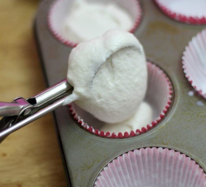 Madagascar Vanilla Bean Cupcake batter scoop into cupcake pan