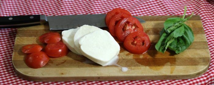 Tomato Mozzarella Caprese Salad is made with fresh ingredients including tomatoes, mozzarella, and basil
