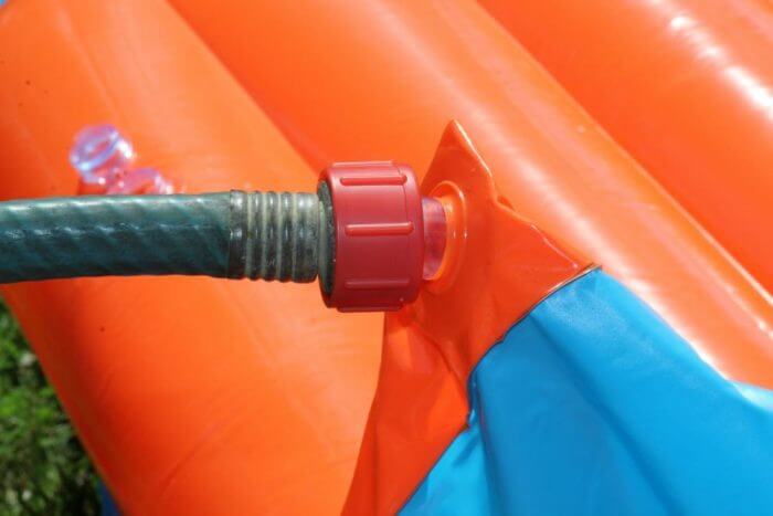 Attach the hose to the water slide