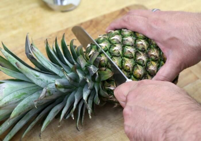 Cut the top off of the pineapple and save it